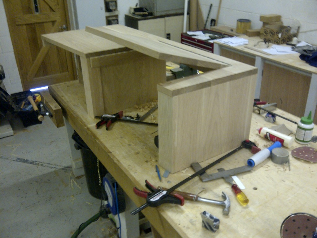 Bespoke fitted oak home office furniture incorporating toy storage